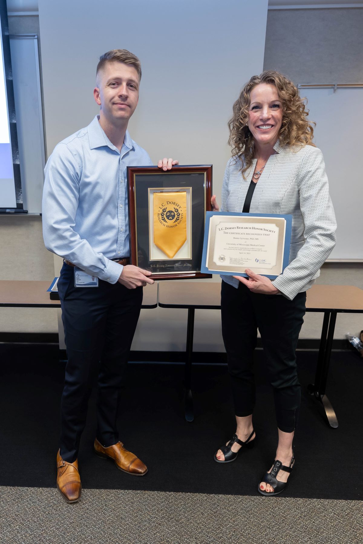 Dr. Reneker standing with another L.C. Dorsey Honor Society Inductee at the 2023 SOPH Research Day